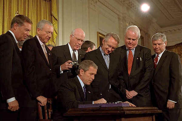 President George W. Bush signs the Patriot Act, Anti-Terrorism Legislation, in the East Room Oct. 26, 2001.