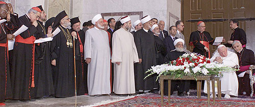 Syria's Grand Mufti Sheikh Ahmad Kuftaro, seated left, meets Pope John Paul II  at the Umayyad Mosque compound in old Damascus